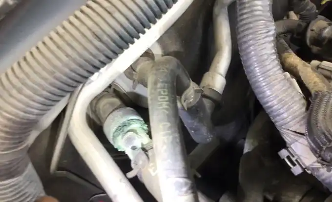 A leaking coolant hose found during a digital vehicle inspection at Beacon Auto Care San Mateo