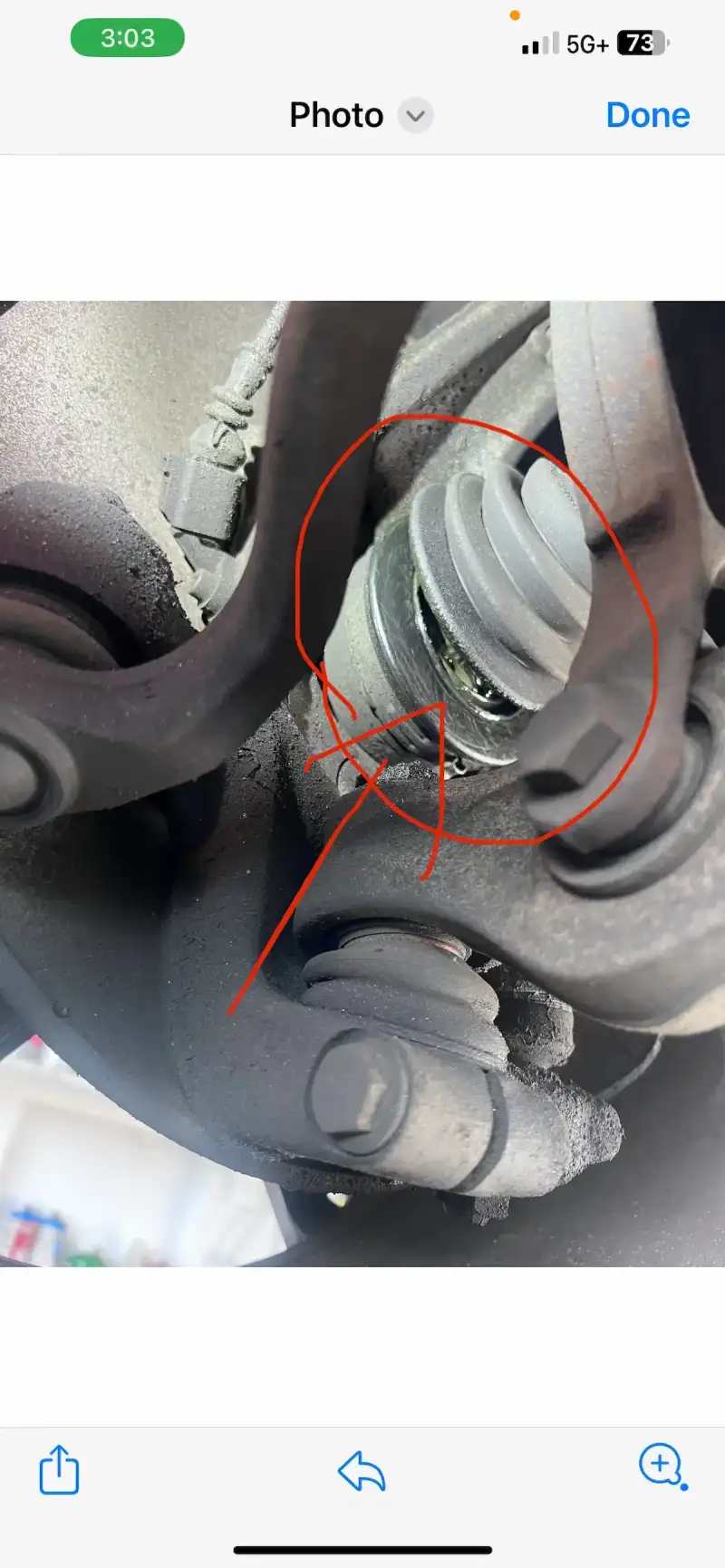 A digital vehicle inspection finding on a phone — a photo of a worn CV axle boot with a line-item note, the kind of evidence Beacon Auto Care texts to customers before quoting a repair