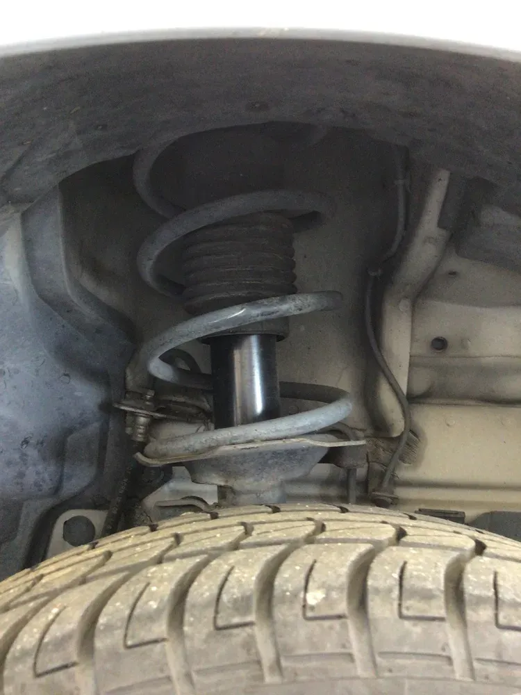 Worn front strut — clunk over bumps