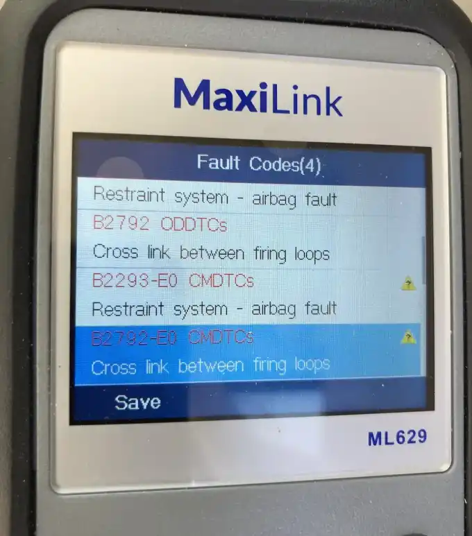 OBD scan tool reading fault codes on a vehicle in the bay at Beacon Auto Care San Mateo