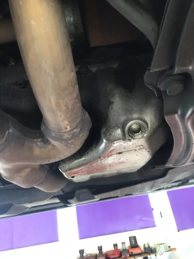Oil pan gasket leak found during high mileage oil change inspection at Beacon Auto Care San Mateo