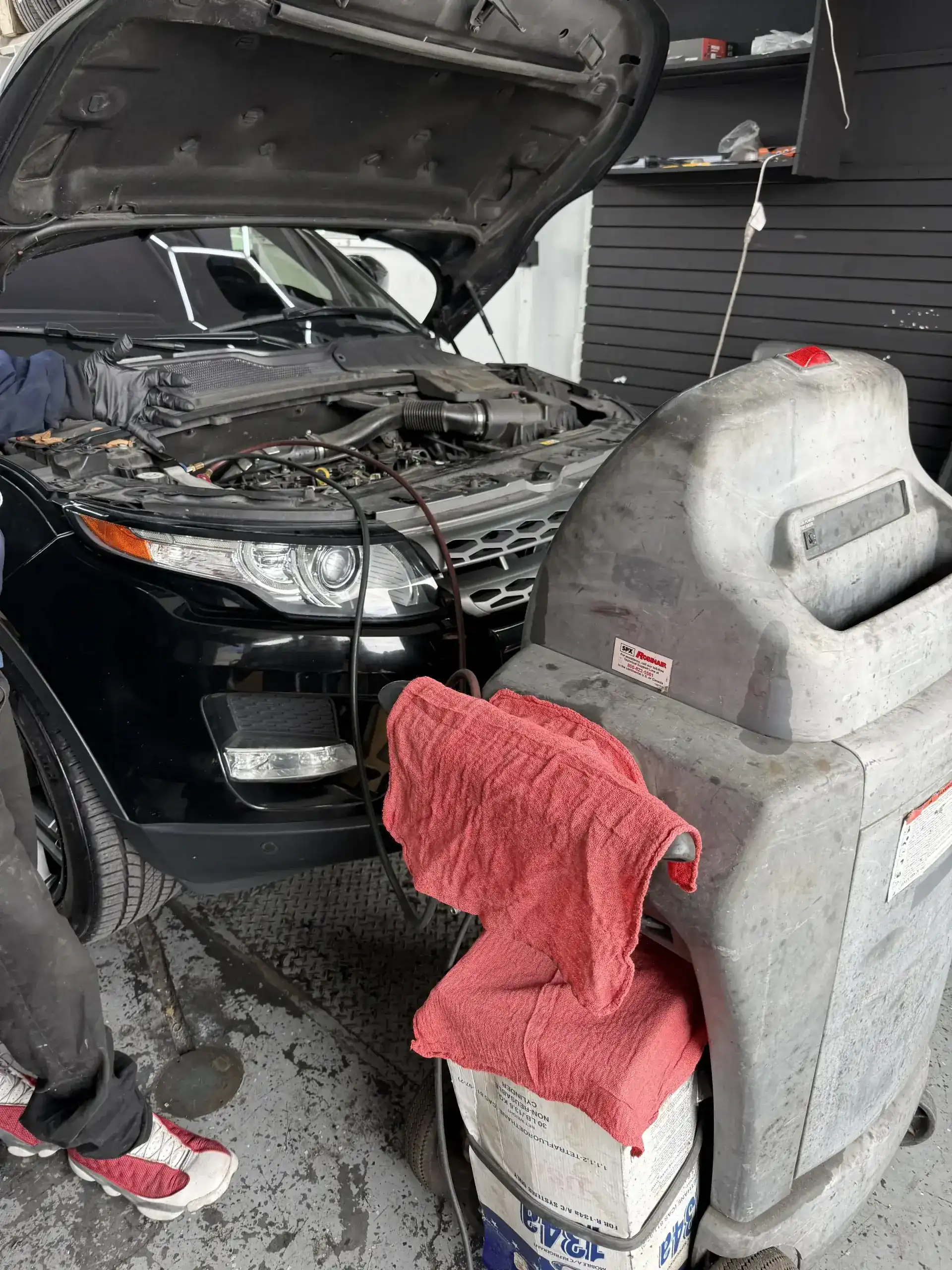 Range Rover Evoque AC recharge in progress with Robinair machine connected at Beacon Auto Care San Mateo