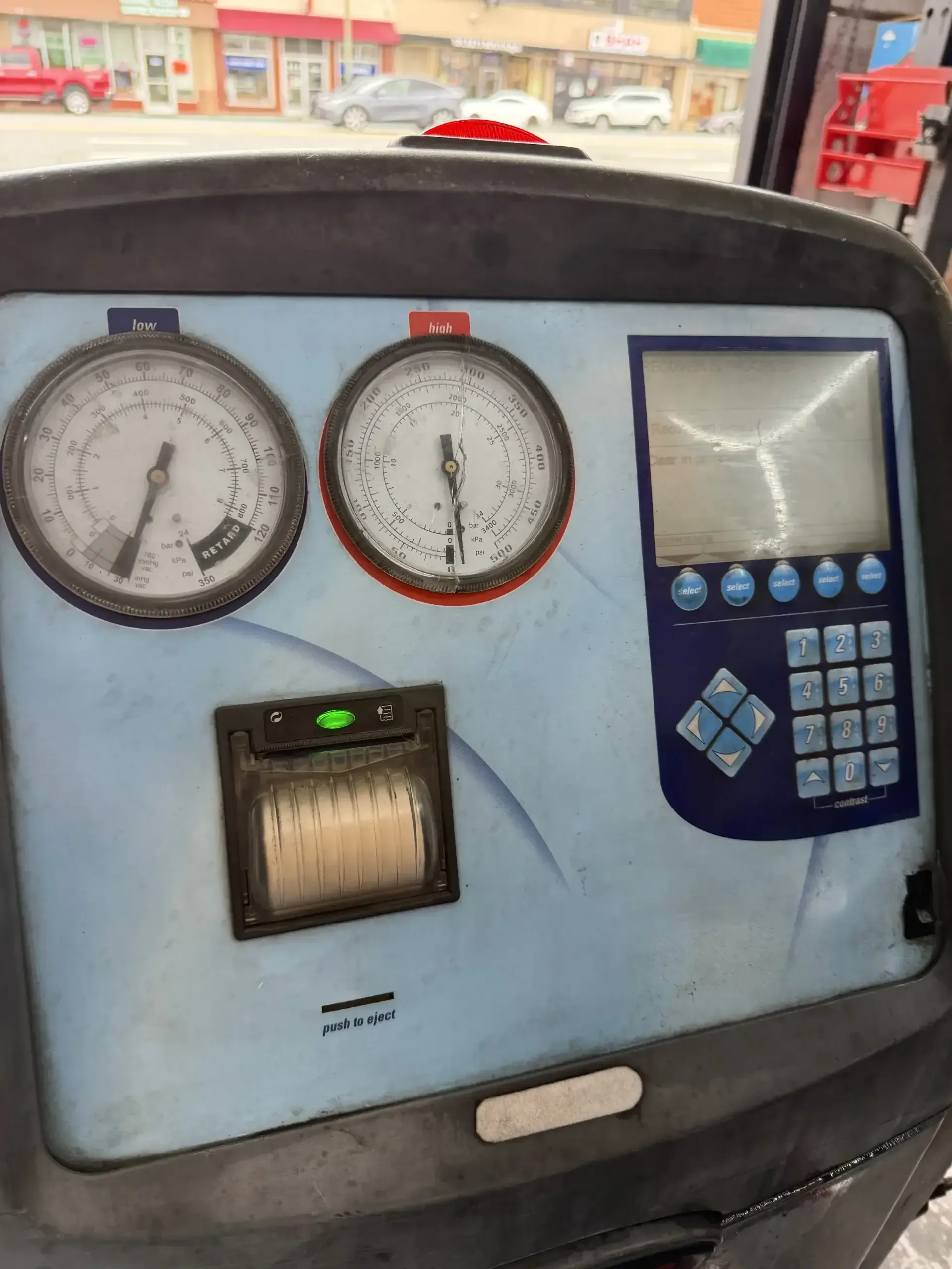 Robinair AC recharge machine front panel with low and high side gauges