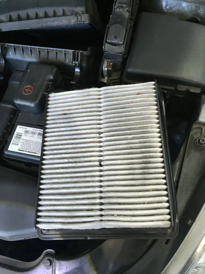 Very dirty engine air filter removed from a 2013 Hyundai Sonata during a San Mateo digital vehicle inspection