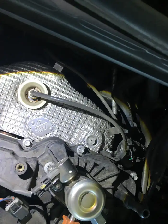 Oil residue at the timing cover area of a 2013 Hyundai Sonata engine during a digital vehicle inspection in San Mateo
