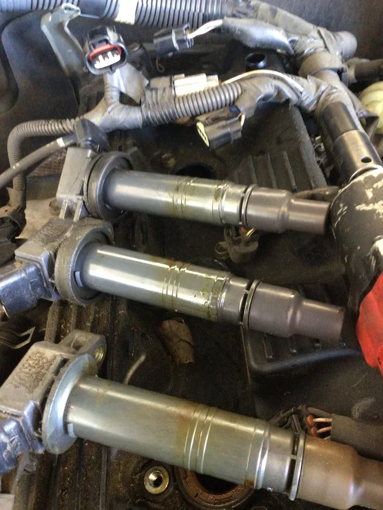 Spark plugs worn and oil-fouled at Beacon Auto Care San Mateo